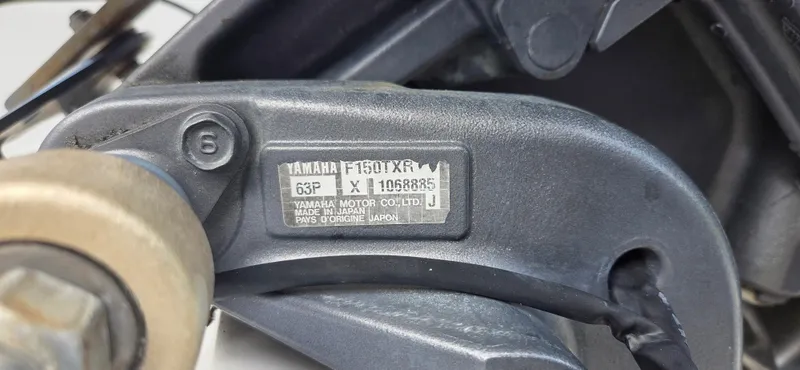 Slide: The Image of Close-up of Yamaha F150TXR engine label on a 2008 Starcraft 2210 OB Limited boat. - 5