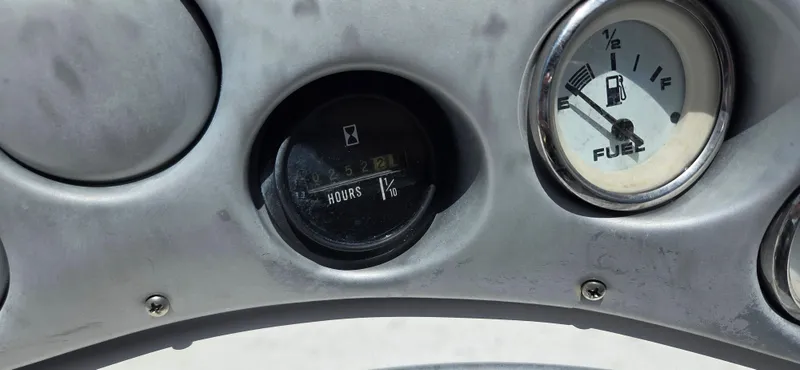 Slide: The Image of Dashboard of 2008 Starcraft 2210 OB Limited showing hour meter and fuel gauge. - 6