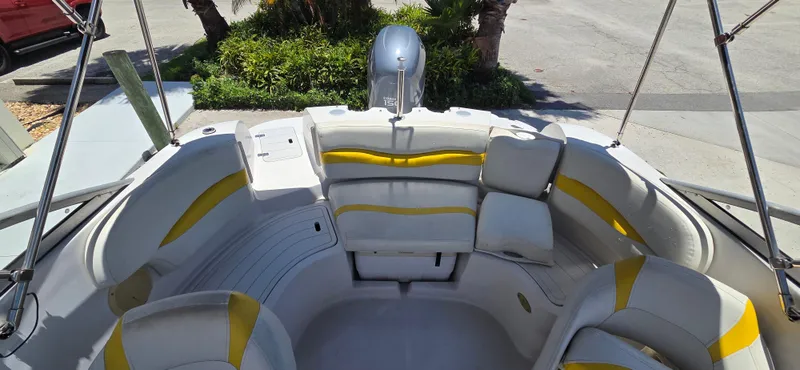 Slide: The Image of 2008 Starcraft 2210 OB Limited boat interior with yellow and white seating. - 7