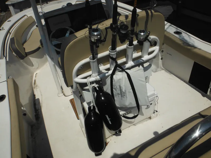 Slide: The Image of 2022 Tidewater 220 LXF boat interior with fishing rods and equipment. - 13