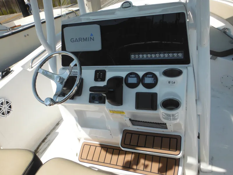 Slide: The Image of 2022 Tidewater 220 LXF boat console with Garmin navigation and hydraulic steering. - 17