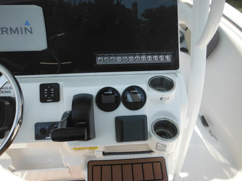 Slide: The Image of Control panel of 2022 Tidewater 220 LXF boat with Garmin electronics and Yamaha controls. - 21