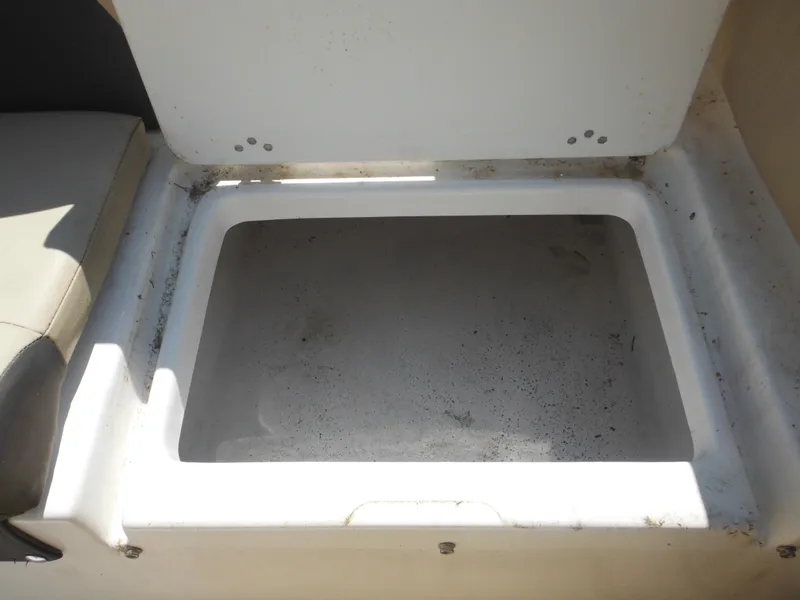 Slide: The Image of Open storage compartment on a 2022 Tidewater 220 LXF boat. - 28