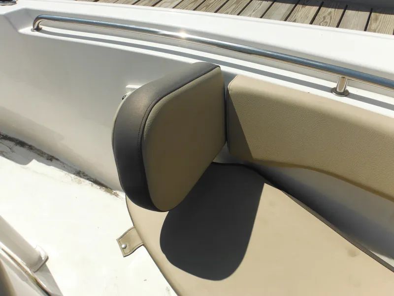 Slide: The Image of 2022 Tidewater 220 LXF boat seat with beige upholstery and stainless steel railing. - 42