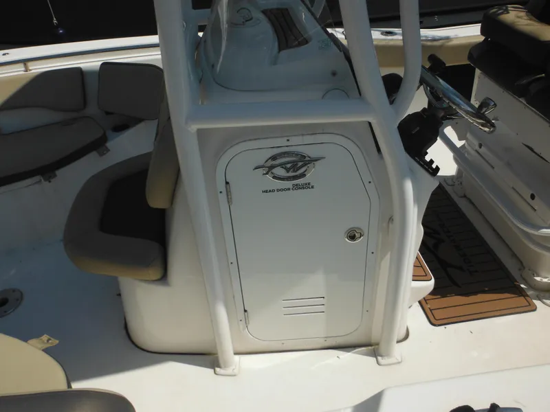 Slide: The Image of 2022 Tidewater 220 LXF boat interior with deluxe head door console. - 5