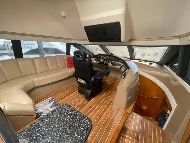 Slide: The Image of Luxurious 2000 Carver 530 Voyager Pilothouse interior with leather seating and modern helm. - 10