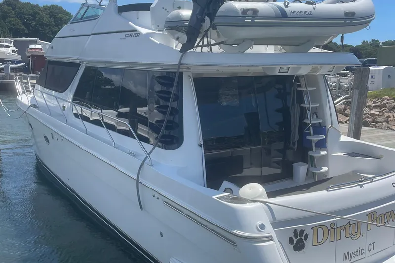 Slide: The Image of 2000 Carver 530 Voyager Pilothouse yacht docked in Mystic, CT marina. - 2