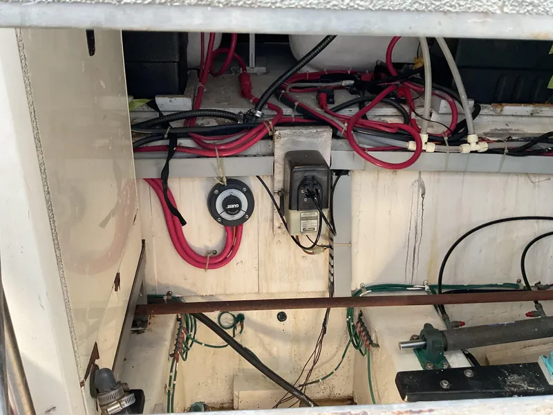 Slide: The Image of Electrical wiring and components inside a 2000 Carver 530 Voyager Pilothouse boat. - 24