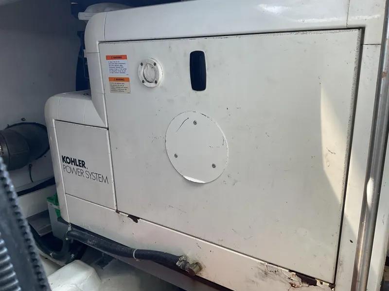 Slide: The Image of Kohler power system in a 2000 Carver 530 Voyager Pilothouse yacht engine room. - 26