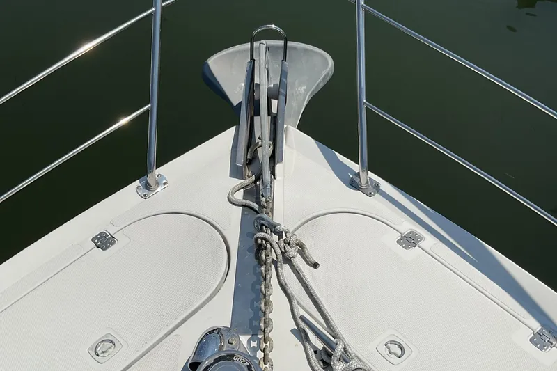 Slide: The Image of Bow of 2000 Carver 530 Voyager Pilothouse with anchor and railing. - 4