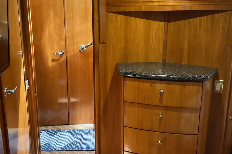 Slide: The Image of Interior of 2000 Carver 530 Voyager Pilothouse with wooden cabinetry and granite countertop. - 17