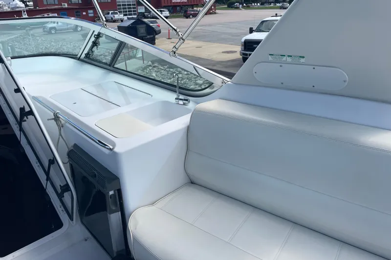 Slide: The Image of Interior view of a 2000 Carver 530 Voyager Pilothouse, featuring white seating and sleek design. - 33