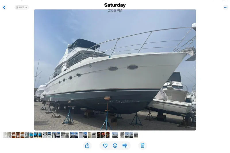 Slide: The Image of 2000 Carver 530 Voyager Pilothouse yacht on stands in a marina. - 34