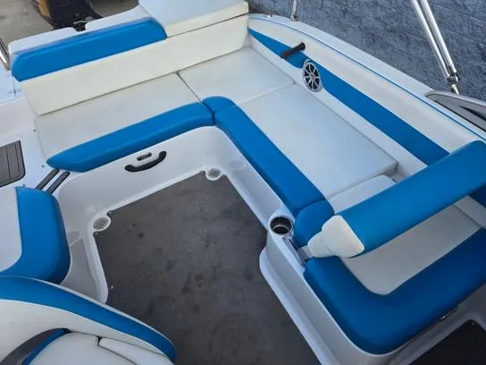 Slide: The Image of 2015 Bryant Sportabout boat interior with blue and white seating. - 6