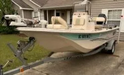 Slide: The Image of 2019 Carolina Skiff 18JVX boat on trailer, parked in residential driveway. - 1