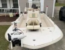 Slide: The Image of 2019 Carolina Skiff 18JVX boat with motor, parked in driveway. - 2