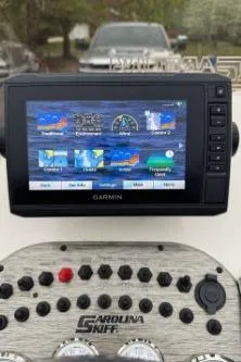 Slide: The Image of Garmin navigation system on 2019 Carolina Skiff 18JVX boat dashboard with control panel. - 3