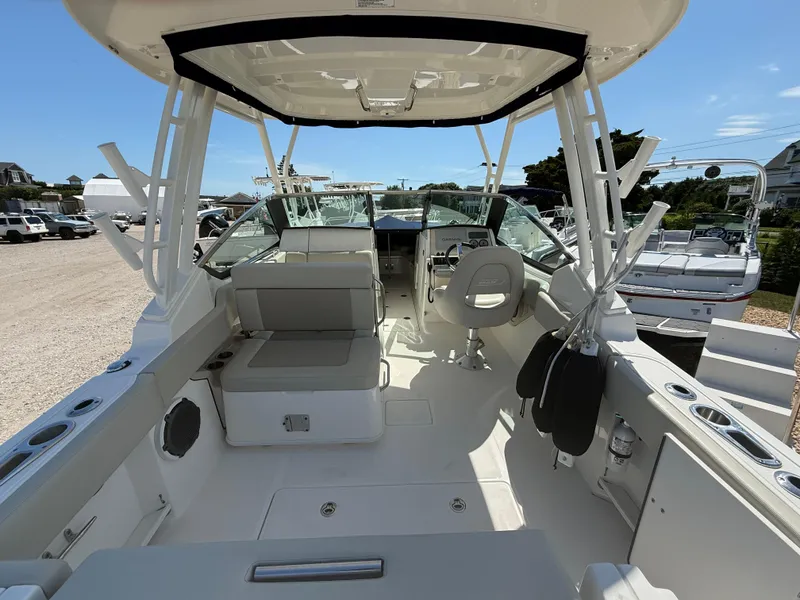 Slide: The Image of 2021 Boston Whaler 240 Vantage boat interior with seating and steering wheel. - 7