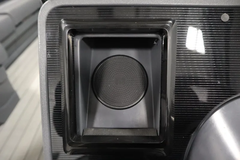 Slide: The Image of Close-up of a 2025 Manitou 24 Explore Switchback Tritoon dashboard compartment. - 24