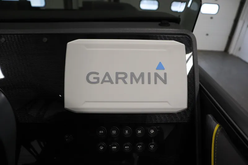 Slide: The Image of Garmin device on 2025 Manitou 24 Explore Switchback Trifold Tritoon dashboard. - 26