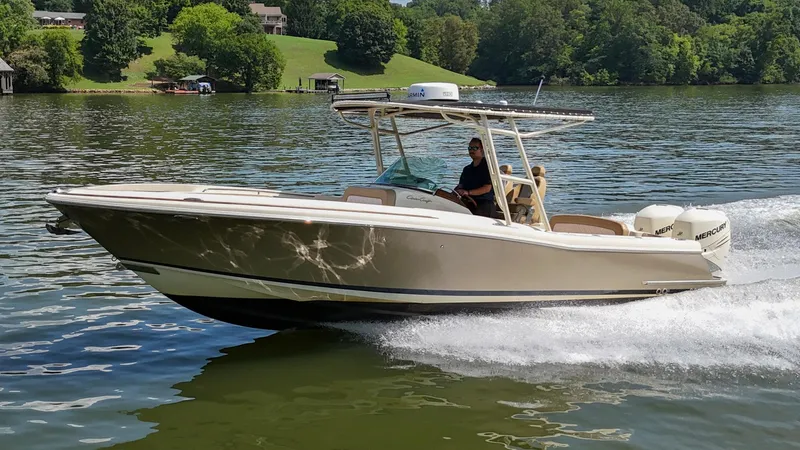 The Image of 2016 Chris-Craft Catalina 29 boat on trailer, featuring dual Mercury engines. - 0