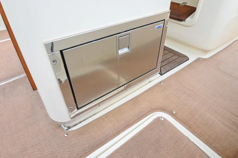 Slide: The Image of 2016 Chris-Craft Catalina 29 boat interior with stainless steel storage compartment. - 26