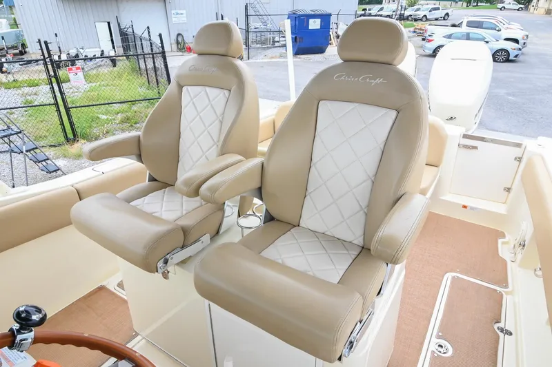 Slide: The Image of 2016 Chris-Craft Catalina 29 boat seats with beige and white diamond-pattern upholstery. - 33