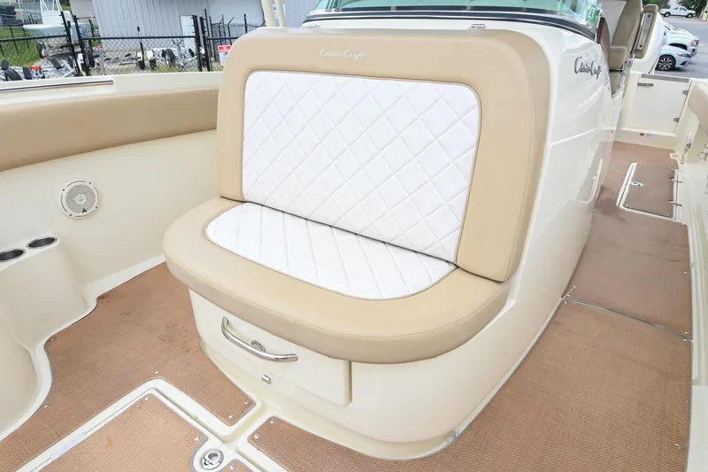 Slide: The Image of 2016 Chris-Craft Catalina 29 boat interior with beige and white seating. - 36