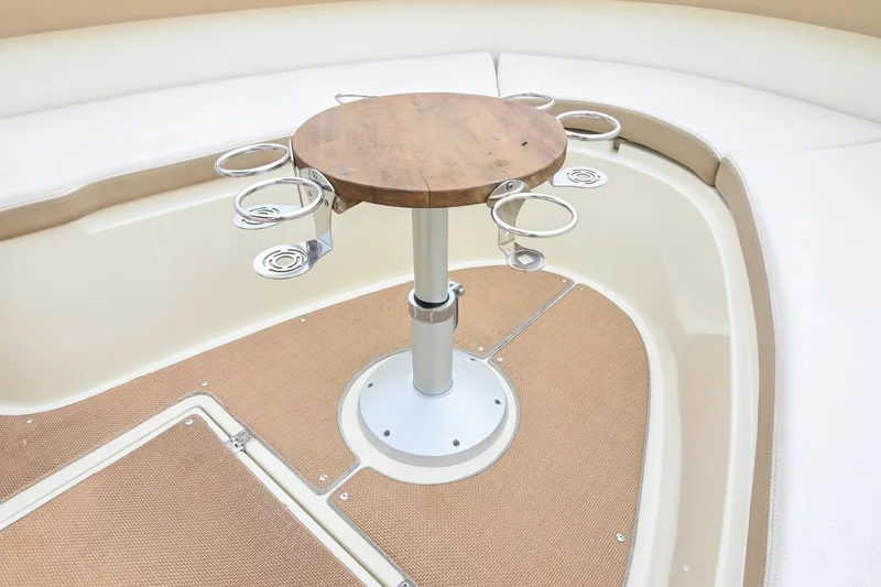 Slide: The Image of 2016 Chris-Craft Catalina 29 boat interior with round table and cup holders. - 38