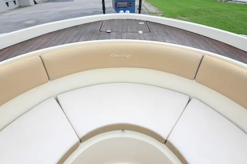 Slide: The Image of 2016 Chris-Craft Catalina 29 boat with beige and white seating, wooden deck. - 40