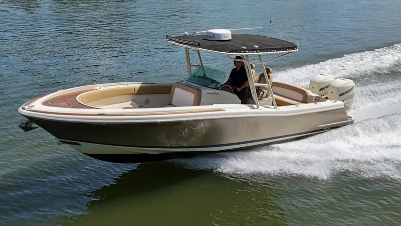 Slide: The Image of 2016 Chris-Craft Catalina 29 boat cruising on water with dual Mercury engines. - 46