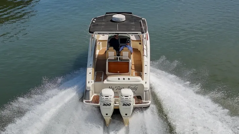 Slide: The Image of 2016 Chris-Craft Catalina 29 boat cruising on water with dual engines. - 47