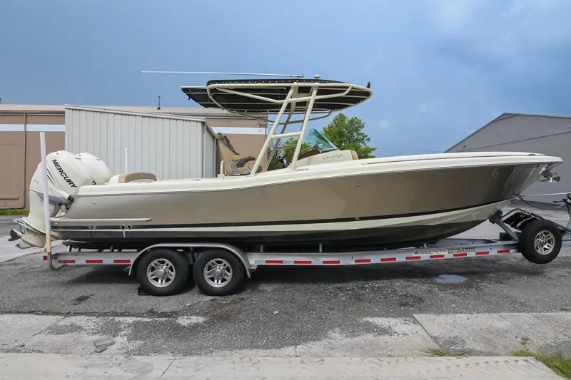 Slide: The Image of 2016 Chris-Craft Catalina 29 boat cruising on water, aerial view. - 7