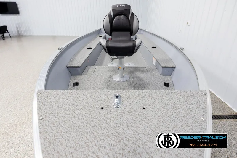 Slide: The Image of 2026 Lund 1600 Fury Tiller boat interior with seating and storage compartments. - 11