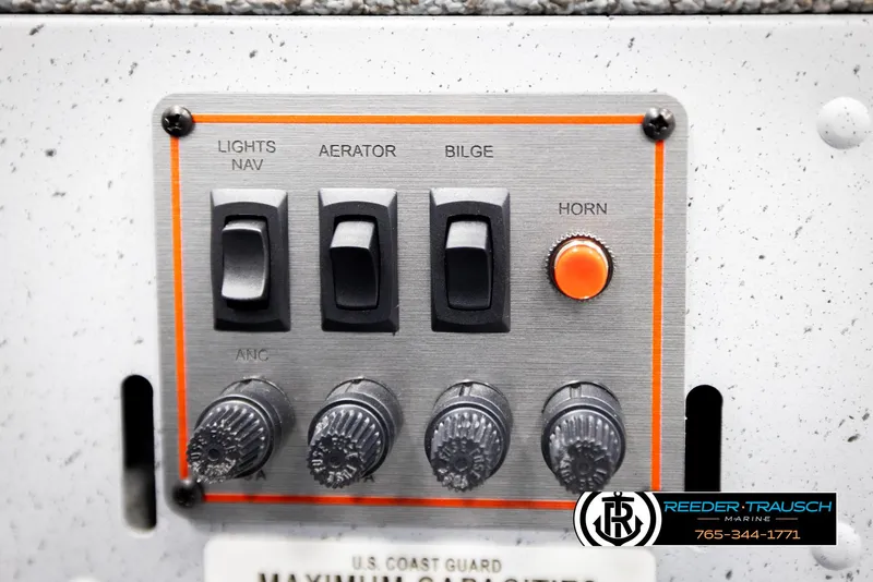 Slide: The Image of Control panel of 2026 Lund 1600 Fury Tiller boat with switches and horn button. - 22