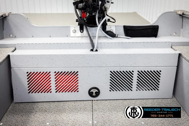 Slide: The Image of 2026 Lund 1600 Fury Tiller boat interior with control panel and Reeder-Trausch Marine logo. - 24