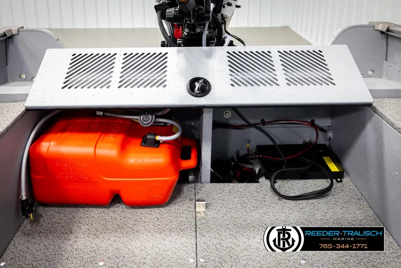 Slide: The Image of 2026 Lund 1600 Fury Tiller boat interior showing fuel tank and battery compartment. - 25