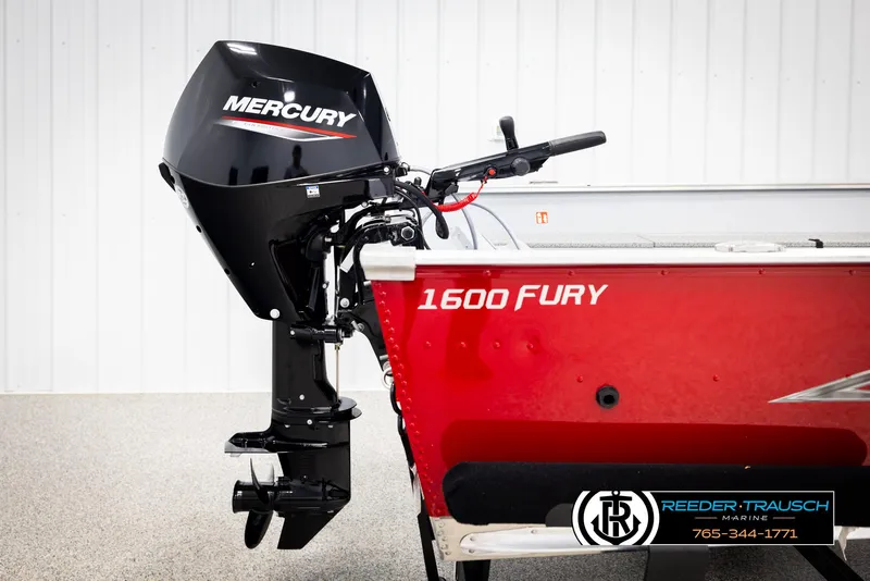Slide: The Image of 2026 Lund 1600 Fury Tiller boat with Mercury outboard motor, red exterior. - 28