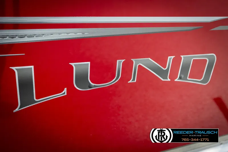 Slide: The Image of Red Lund 1600 Fury Tiller boat with logo and Reeder-Trausch Marine contact details. - 35