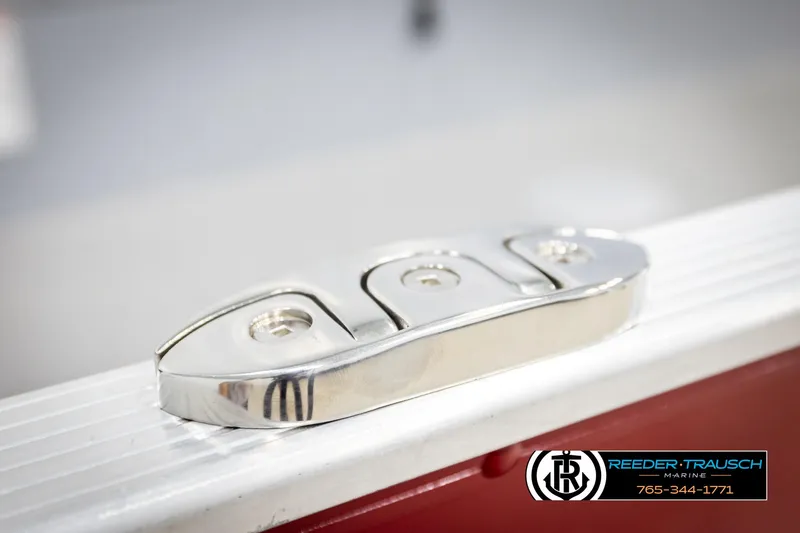 Slide: The Image of Close-up of a 2026 Lund 1600 Fury Tiller boat cleat, featuring a sleek metallic design. - 37