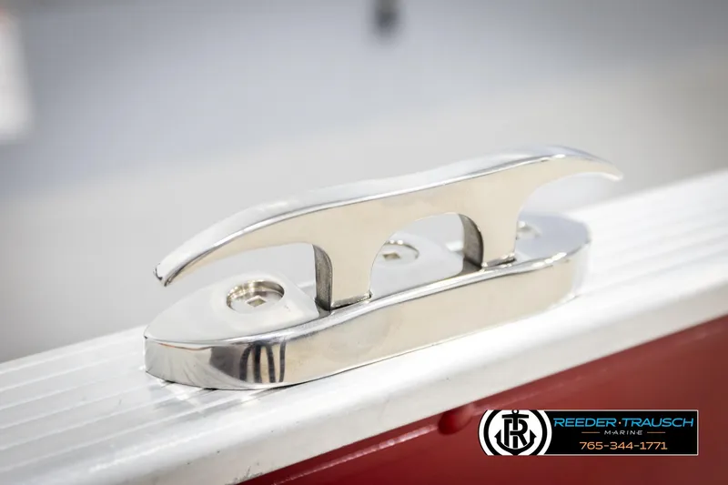 Slide: The Image of Stainless steel cleat on 2026 Lund 1600 Fury Tiller boat, Reeder-Trausch Marine logo. - 38
