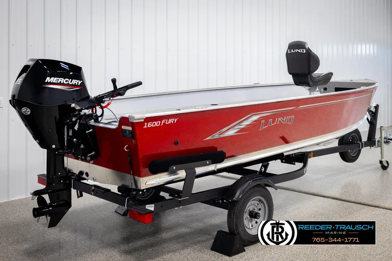 Slide: The Image of 2026 Lund 1600 Fury Tiller boat with Mercury engine on trailer in showroom. - 4