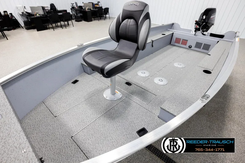 Slide: The Image of 2026 Lund 1600 Fury Tiller boat interior with seating and storage compartments. - 8