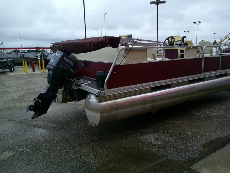 Slide: The Image of Pontoon boat with Yamaha motor, Misty Harbor 2020 EF, 1997 model, parked on wet pavement. - 10