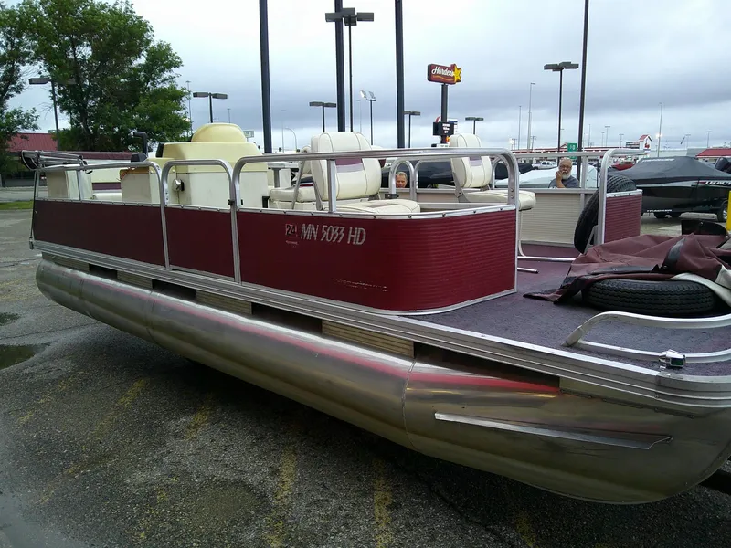 Slide: The Image of Red Misty Harbor 2020 EF pontoon boat, parked in a lot, overcast sky. - 12