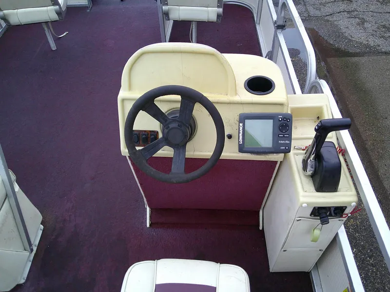 Slide: The Image of Pontoon boat helm with steering wheel, control panel, and GPS device, Misty Harbor 2020 EF. - 4