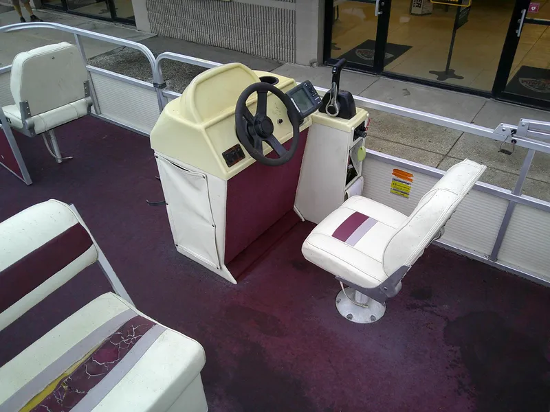 Slide: The Image of Interior of a 1997 Misty Harbor 2020 EF pontoon boat with maroon and white seating. - 5