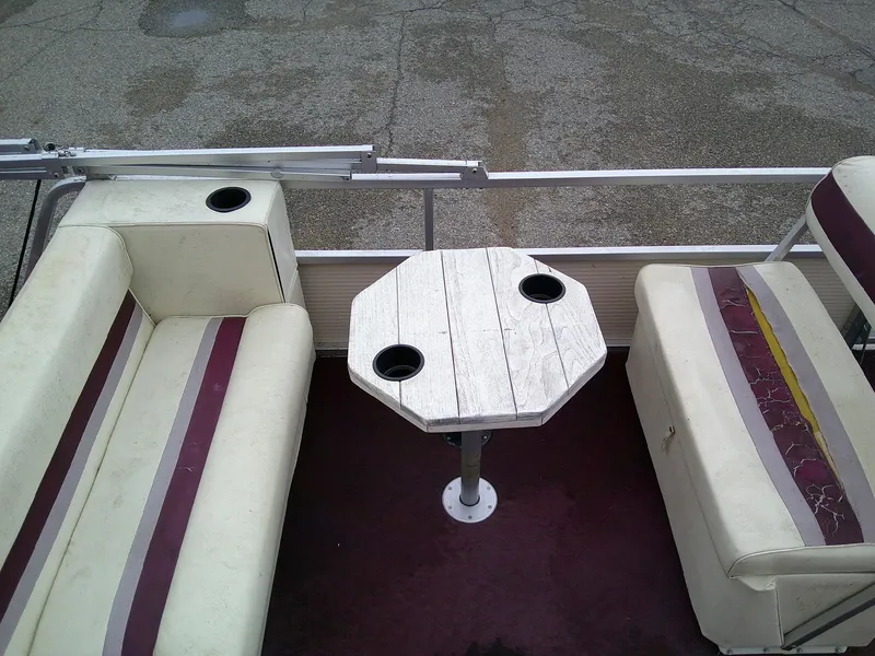 Slide: The Image of Interior of a 1997 Misty Harbor 2020 EF pontoon boat with seating and table. - 6