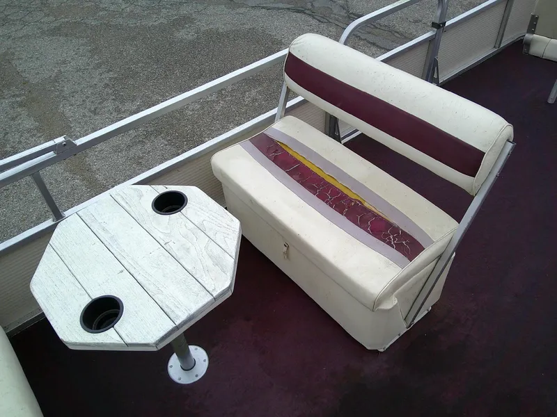 Slide: The Image of Pontoon boat interior with worn seating and a wooden table, Misty Harbor 2020 EF, 1997 model. - 7