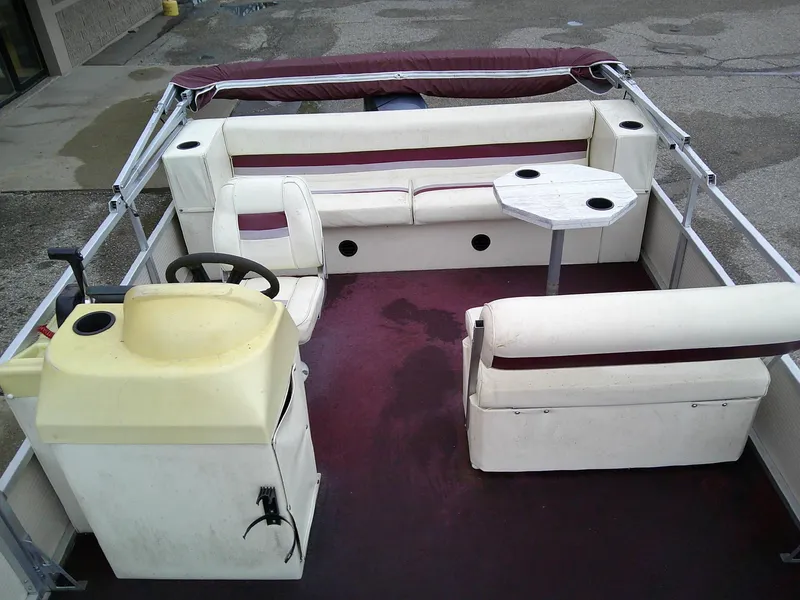 Slide: The Image of Interior of a 1997 Misty Harbor 2020 EF pontoon boat with seating and steering console. - 8